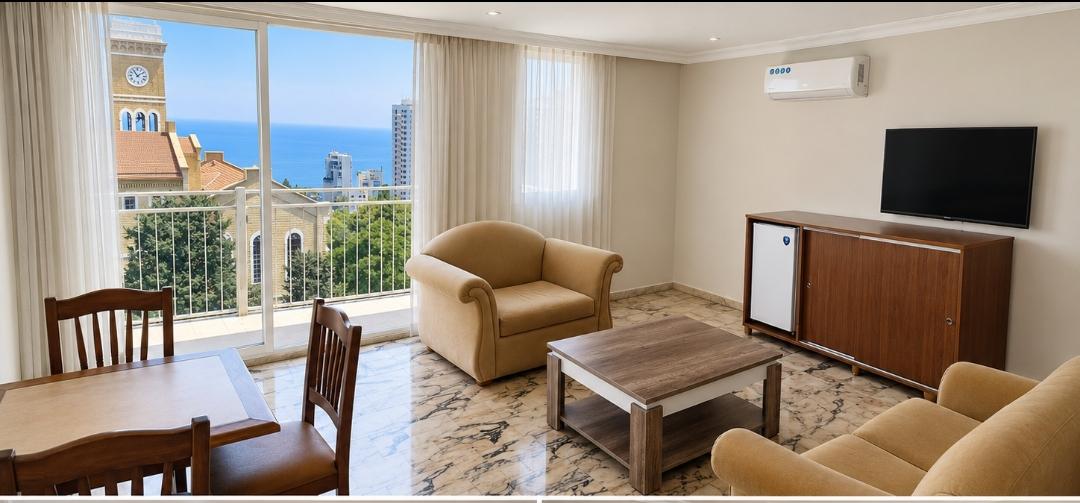 Royal Suite A — sitting room with sea and campus view through the veranda